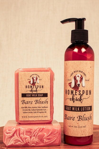 Homespun Chick goat milk soap and lotion set on a wooden surface with a beige background