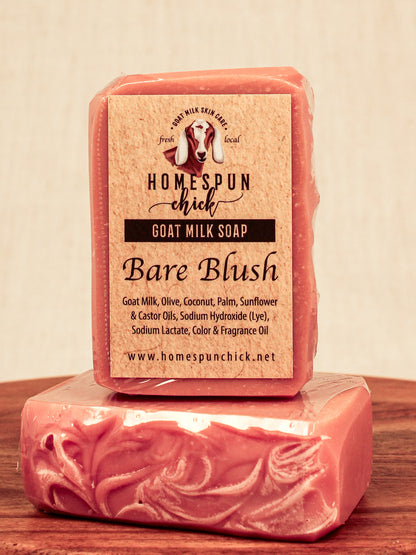 Bar of goat milk soap with a visible label on a wooden surface