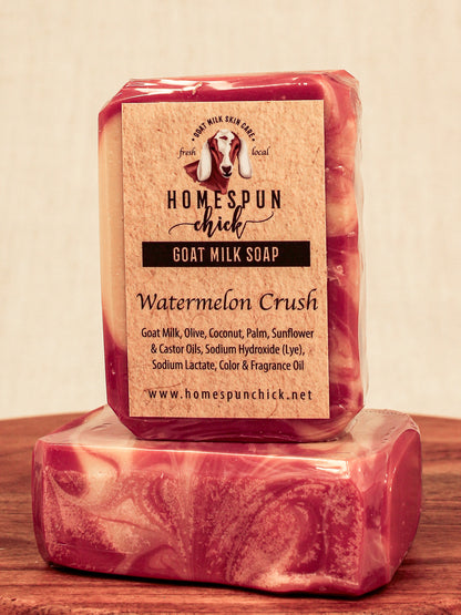 Bar of goat milk soap with 'Homespun Chick' label on a wooden surface