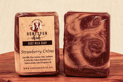 Two bars of soap with a visible label on a wooden surface