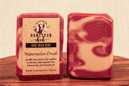 Two bars of soap with a visible label on a wooden surface